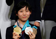 Pyeongchang 2018 Winter Olympics Women's speed skating medallist Miho Takagi poses with hergold, silver and bronze medals at a news conference with other medalists upon their return from the Pyeongchang Winter Games, in Tokyo, Japan, February 26, 2018. REUTERS/Toru Hanai