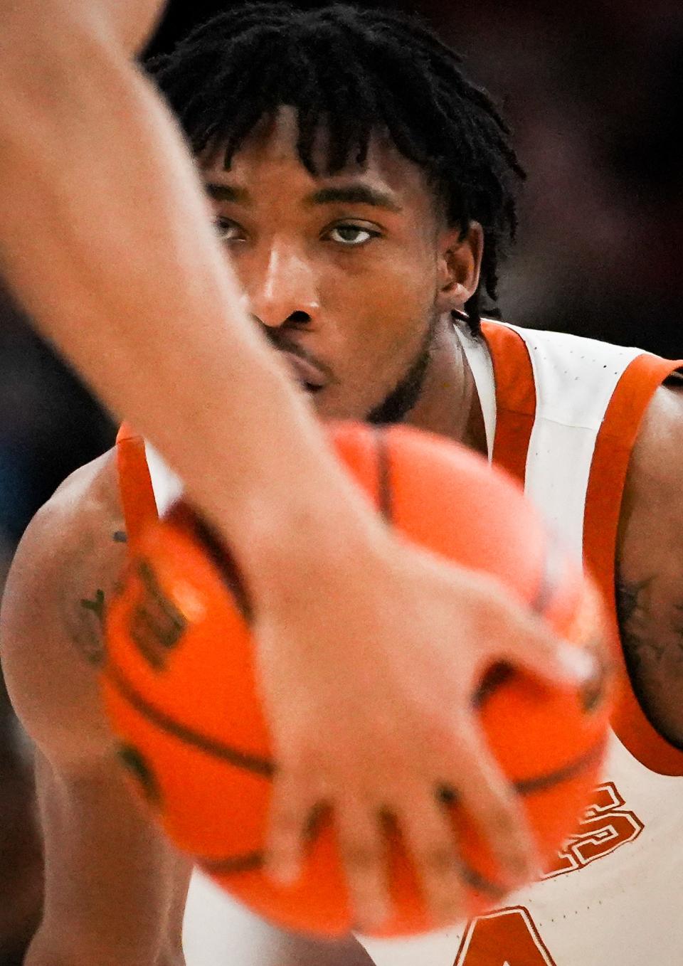 Texas guard Tyrese Hunter watches the ball while defending in the Longhorns' 75-73 win over Baylor on Saturday. Hunter broke out a brief scoring slump against Baylor, which bodes well for the Longhorns during its trip to Oklahoma on Tuesday.