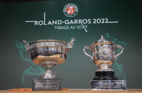 Men's single, left, and women's single cups are displayed during the draw of the French Open tennis tournament at the Roland Garros stadium in Paris, Thursday, May 19, 2022. The French Open tennis tournament starts Sunday May 22. (AP Photo/Michel Euler)