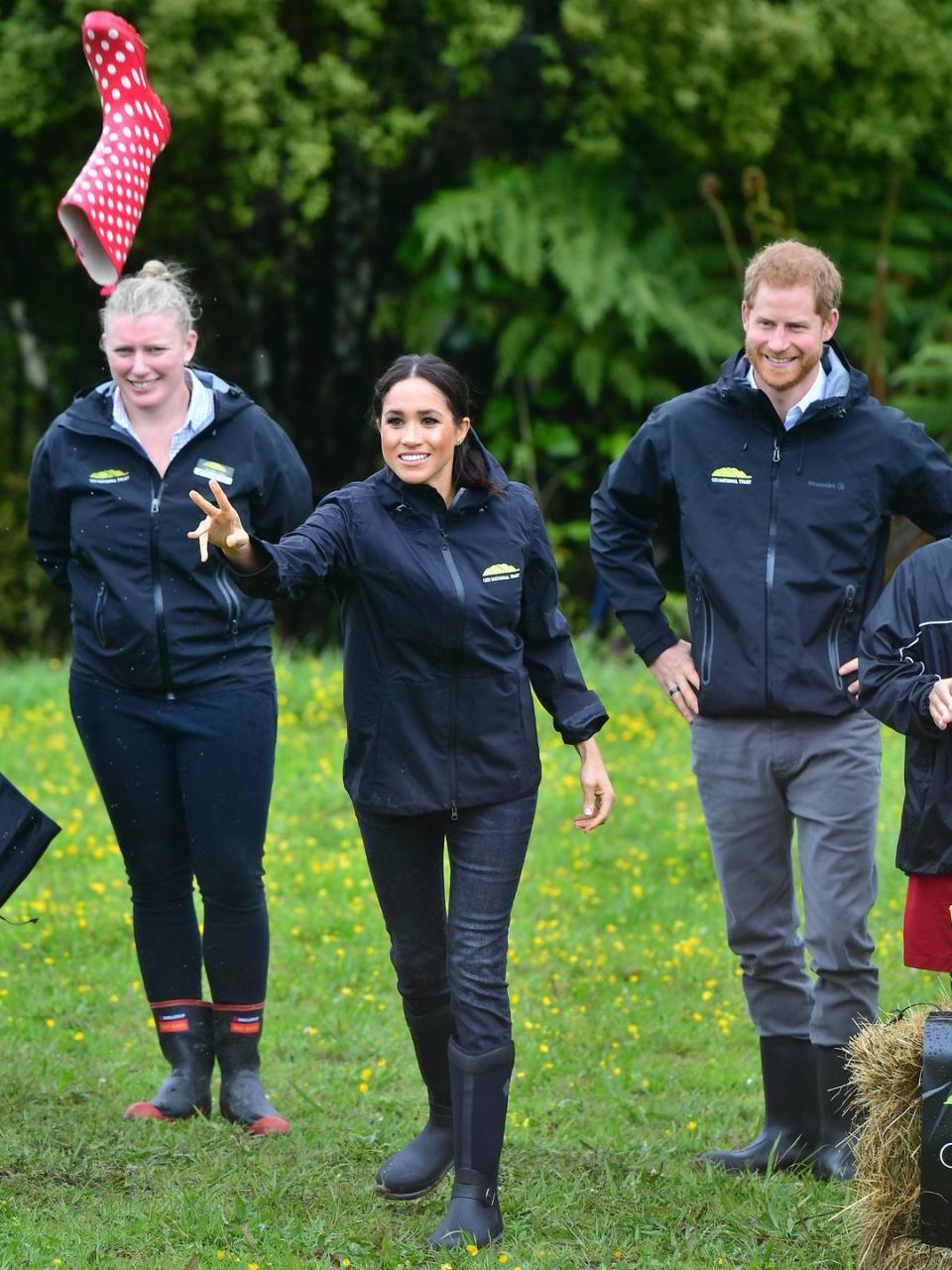 The Duke and Duchess of Sussex participate in a game of 'Welly Wanging' in Redvale.