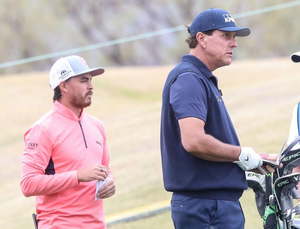 Rickie Fowler, left, and Phil Mickelson wait to tee off on the 1st hole of the Stadium Course during the American Express at PGA West in La Quinta, January 22, 2021. 