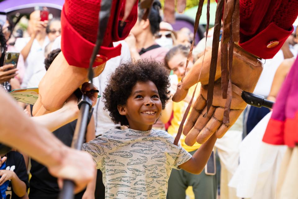 A child connects with Little Amal in New York in 2022.