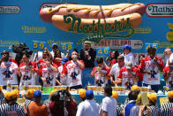 <p>Referees watch the competitors at Nathan’s Famous Fourth of July International Hot Dog Eating Contest at Coney Island in Brooklyn, New York City, U.S., July 4, 2017. (Erik Pendzich/REX/Shutterstock) </p>