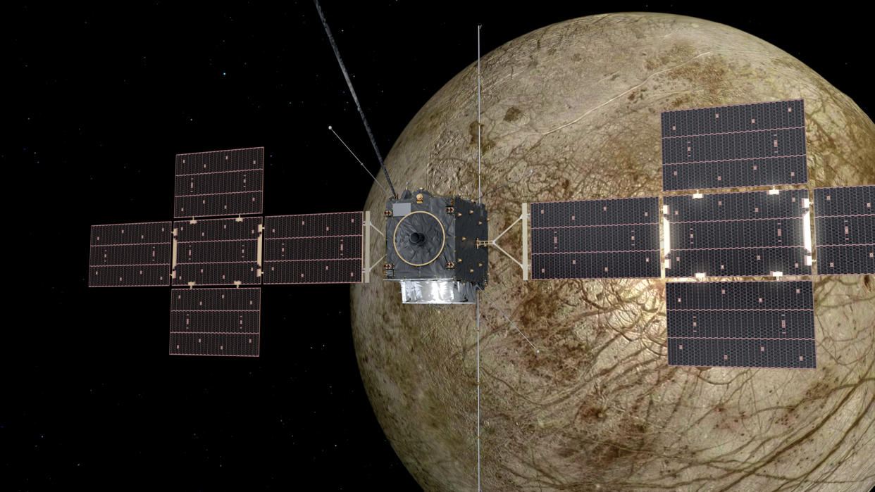  An artist's impression of ESA's JUICE spacecraft in orbit around the ocean moon Europa. 