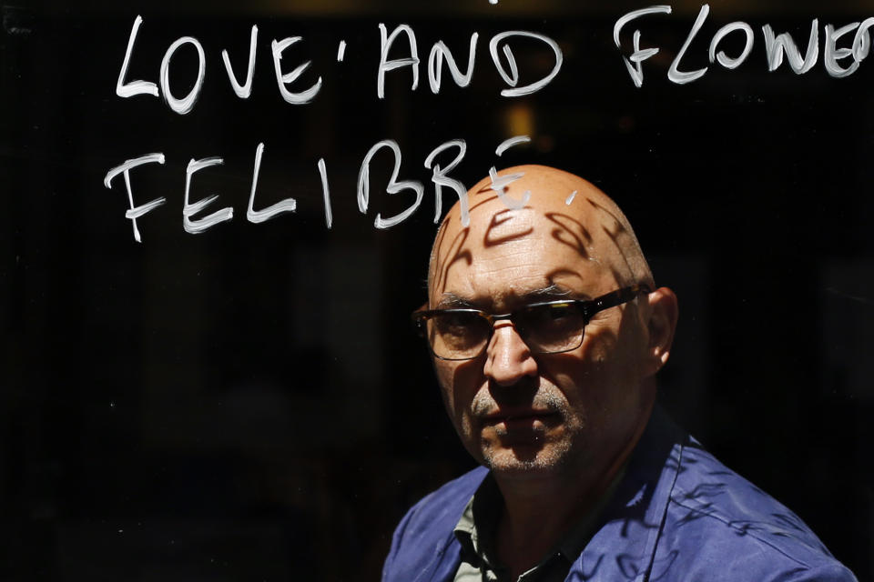 Owner of cafes and bistros, Xavier Denamur, poses for a picture, in Paris, Monday, June 1, 2020. Parisians who have been cooped up for months with take-out food and coffee will be able to savor their steaks tartare in the fresh air and cobbled streets of the City of Light once more -- albeit in smaller numbers. (AP Photo/Thibault Camus)