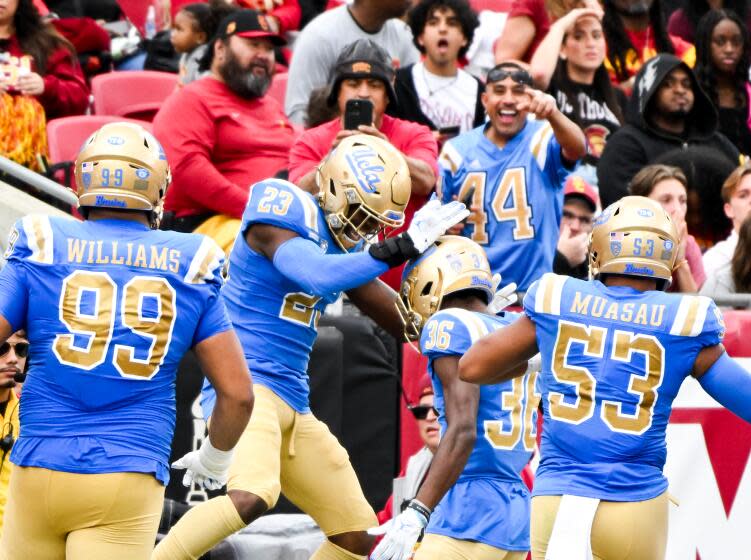 LOS ANGELES, CA - NOVEMBER 18: UCLA Bruins defensive back Kenny Churchwell III (23) celebrates.