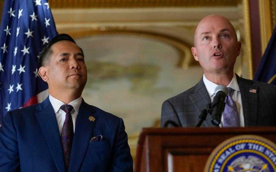 Utah Attorney General Sean Reyes listens as Gov. Spencer Cox speaks during a press conference at the state Capitol on Tuesday, Oct. 10, 2023.