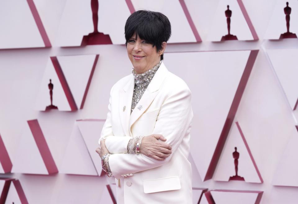 Diane Warren in a Valentino suit with a sparkly turtleneck arrives at the Oscars.