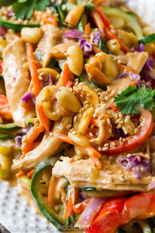 <p>Mixing up weeknight dinners with this wildly flavorful and healthy Asian inspired peanut chicken and veggies dish!</p><p><strong>Get the recipe: <a href="https://sallysbakingaddiction.com/peanut-chicken-zucchini-noodles/" rel="nofollow noopener" target="_blank" data-ylk="slk:Peanut Chicken Zucchini Noodles;elm:context_link;itc:0;sec:content-canvas" class="link ">Peanut Chicken Zucchini Noodles</a></strong></p>