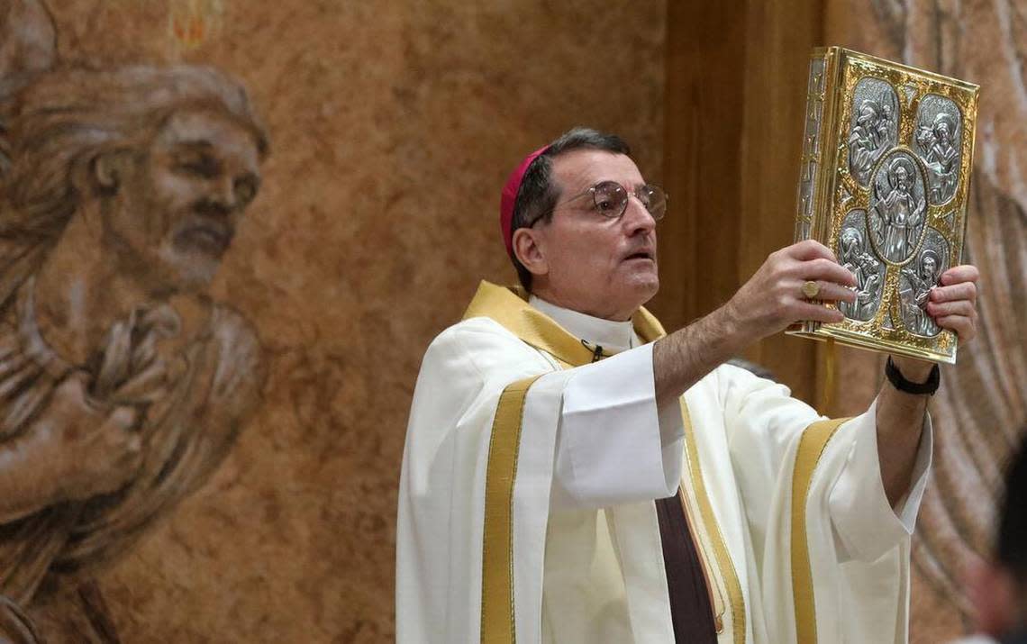 Diocese of Fresno Bishop Joseph V. Brennan holds the bible during the Mass of Ordination to the Order of Deacon at Holy Spirit Catholic Church in Fresno on Oct. 1, 2022.