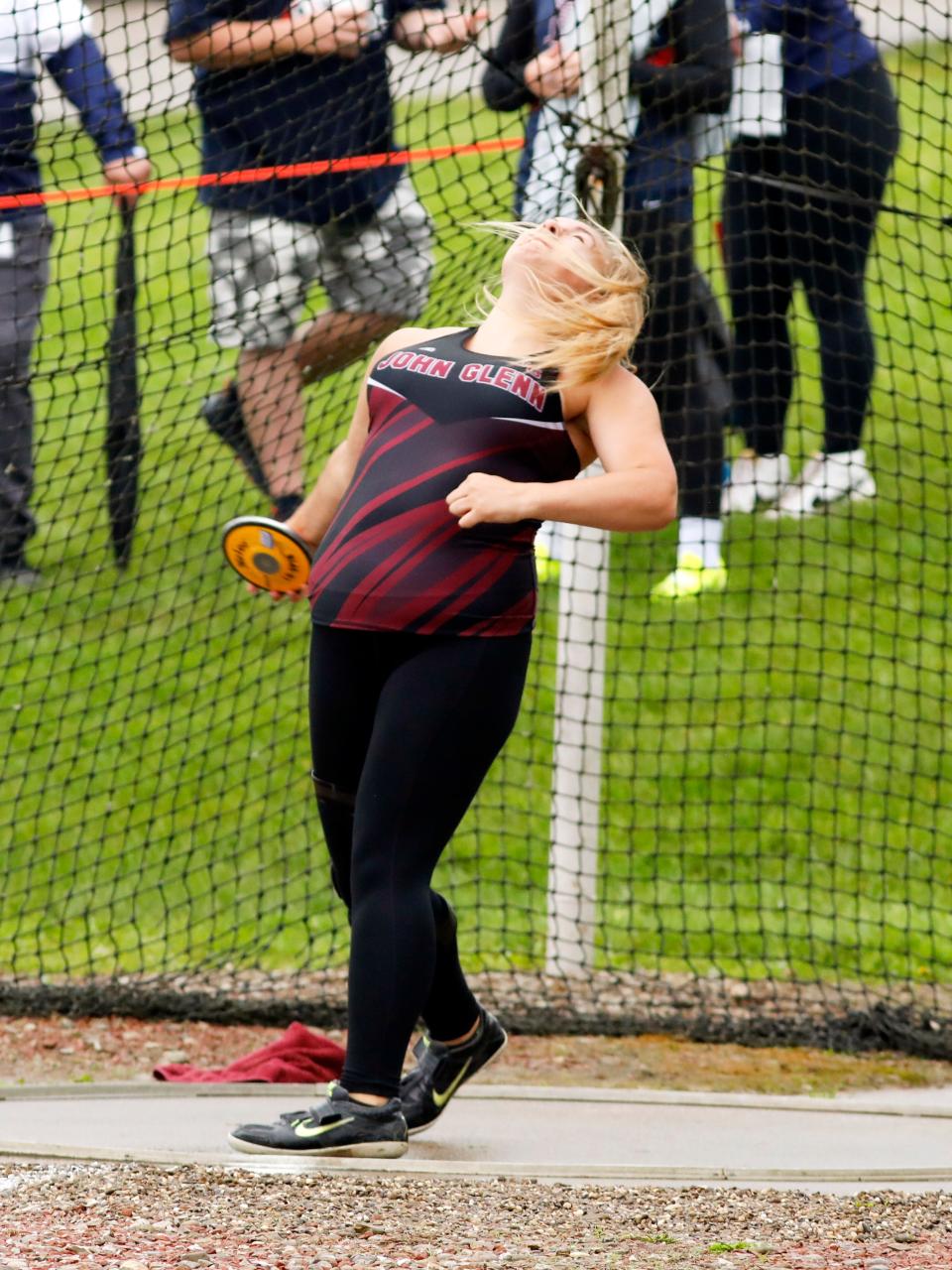 John Glenn's Chelea Sotherden throws the discus during a Division II district track meet on May 20, 2023, at Meadowbrook High School.