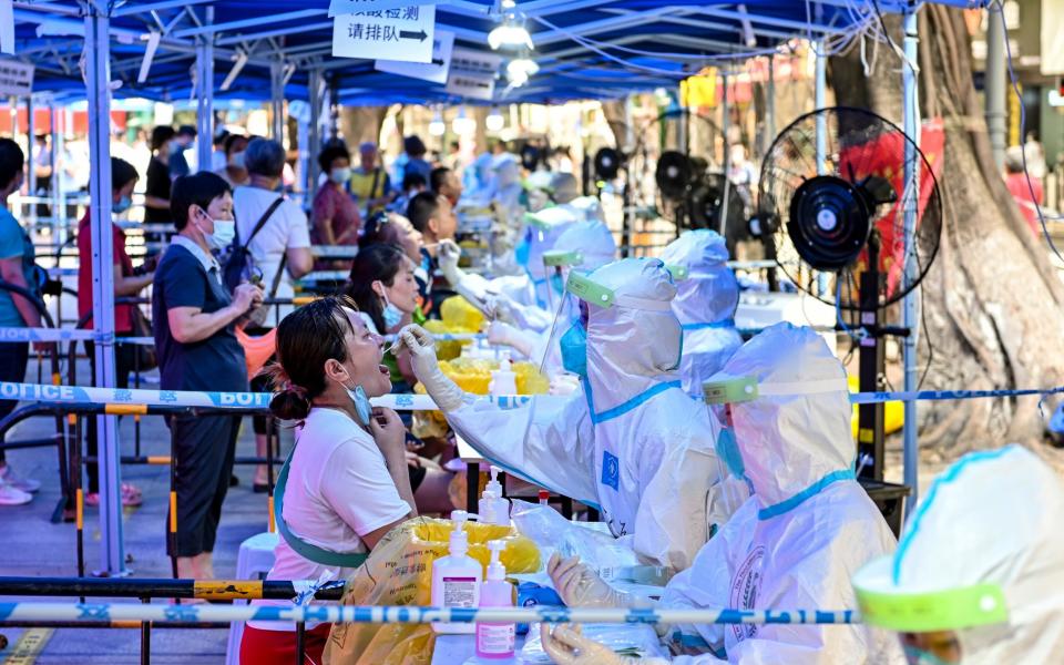 Local residents line up for nucleic acid testing at a temporary Covid testing centre in Liwan district, Guangzhou, Guangdong Province of China - Chen Jimin/China News Service