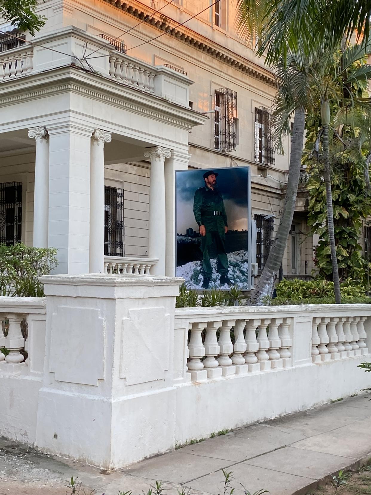 A portrait of Fidel Castro hangs beside a government health care facility in Havana. Photo: Rick Newman