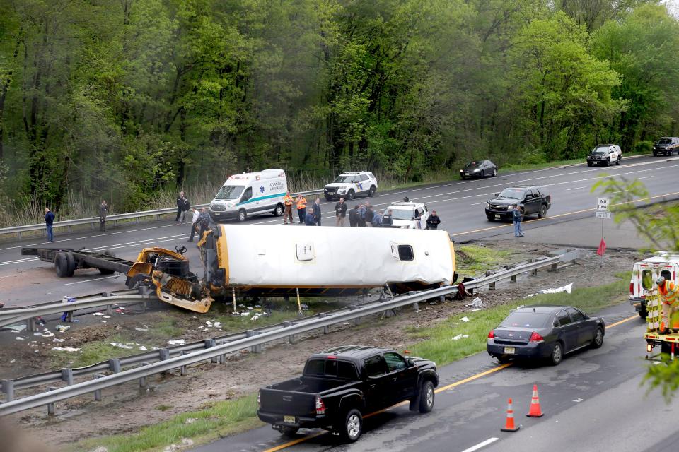 Emergency personnel work at the scene of a school bus and dump truck collision, injuring multiple people, on Interstate 80 in Mount Olive, N.J School Bus Dump Truck Crash - 17 May 2018