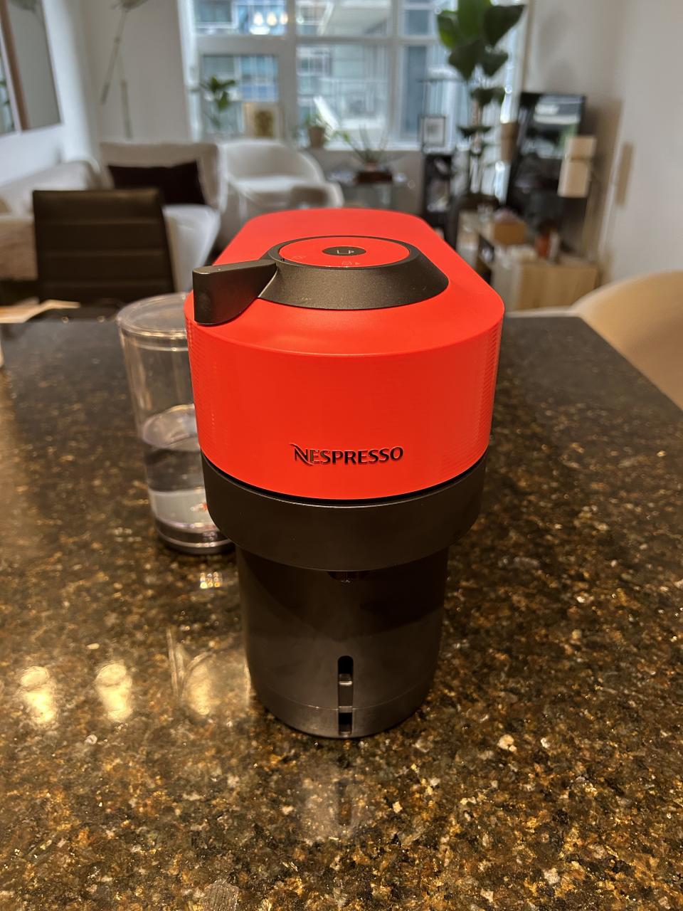 red Vertuo Pop nespresso machine on kitchen counter