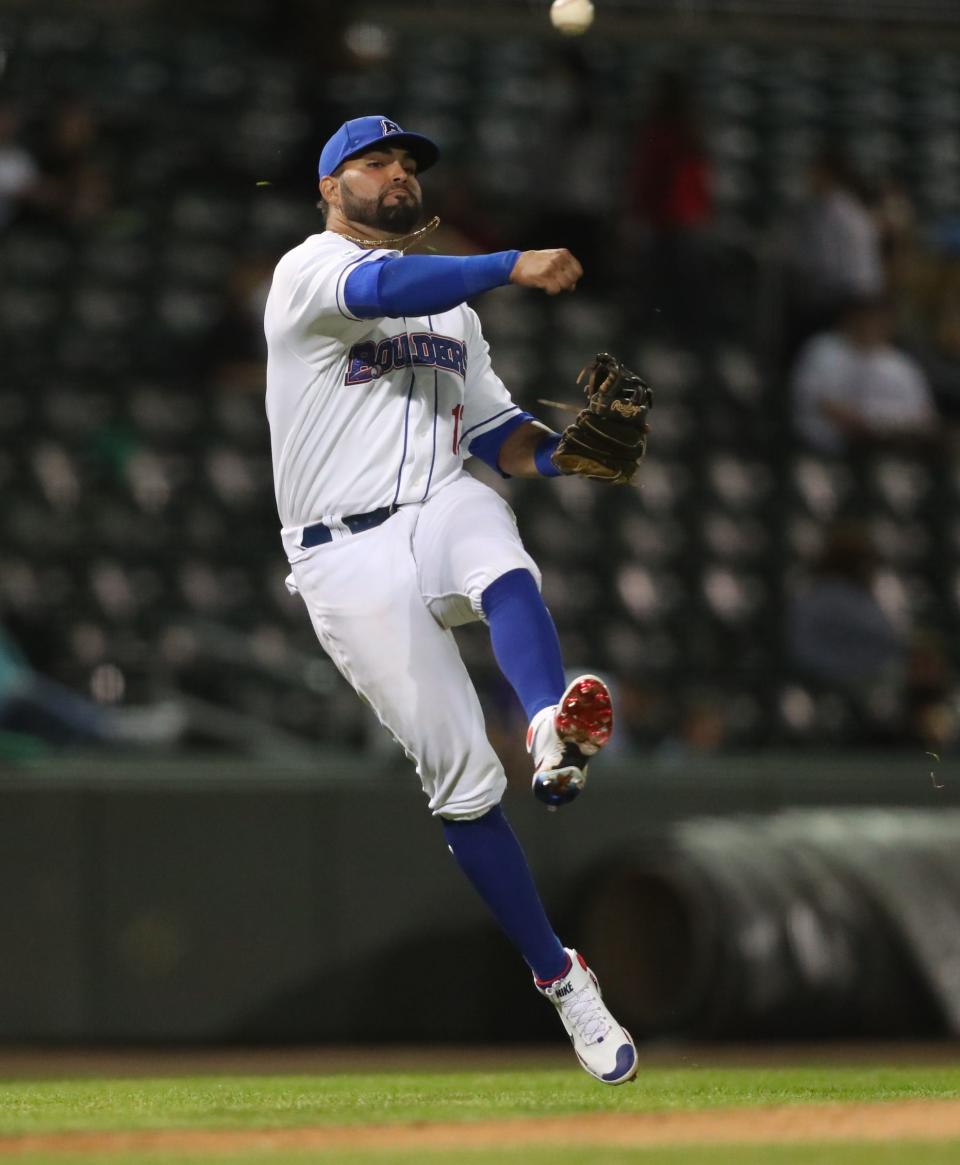 New York Boulders third baseman Gabriel Garcia makes an off-balance throw after picking up a grounder bare-handed during the Boulders' home opener against the Sussex Miners at Clover Stadium in Pomona on Thursday, May 12, 2022.