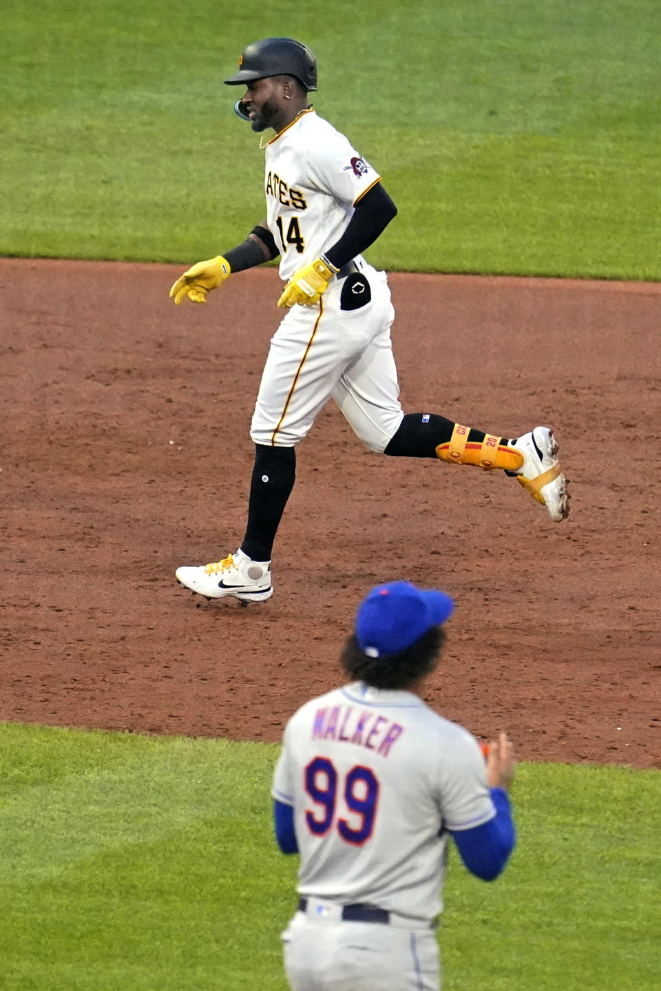 Pittsburgh Pirates' Rodolfo Castro (14) runs the bases after hitting a two-run home run off New York Mets starting pitcher Taijuan Walker (99) during the third inning of a baseball game in Pittsburgh, Tuesday, Sept. 6, 2022. (AP Photo/Gene J. Puskar)