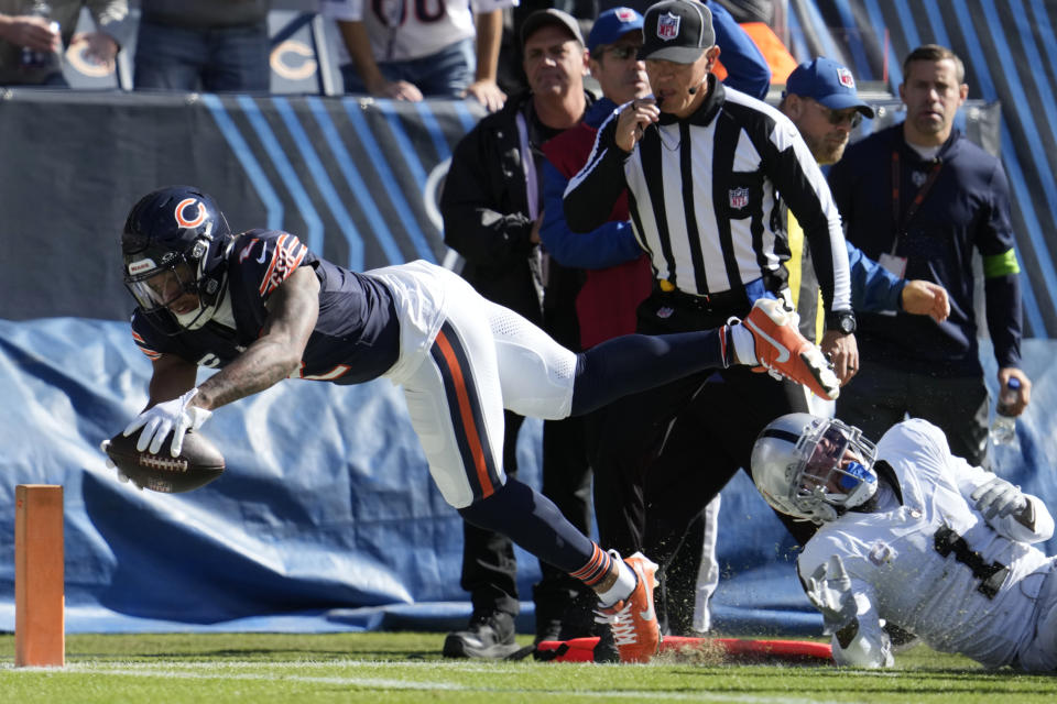 Chicago Bears wide receiver DJ Moore, left, is stopped short of the goal line by Las Vegas Raiders safety Marcus Epps (1) in the first half of an NFL football game, Sunday, Oct. 22, 2023, in Chicago. (AP Photo/Nam Y. Huh)