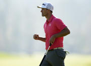 Adam Scott, of Australia, reacts after making a birdie putt on the 17th hole during the final round of the Genesis Invitational golf tournament at Riviera Country Club, Sunday, Feb. 16, 2020, in the Pacific Palisades area of Los Angeles. (AP Photo/Ryan Kang)