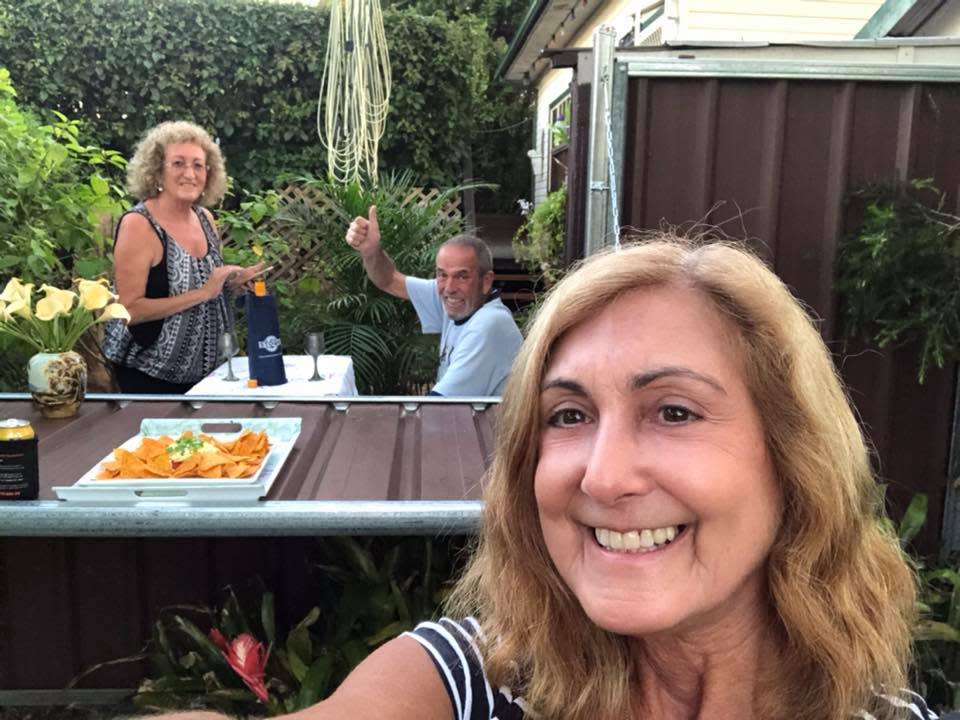 Linda Solomons poses with neighbours and friends of 35 years Jackie and Tony Cliffe over fence coronavirus DIY