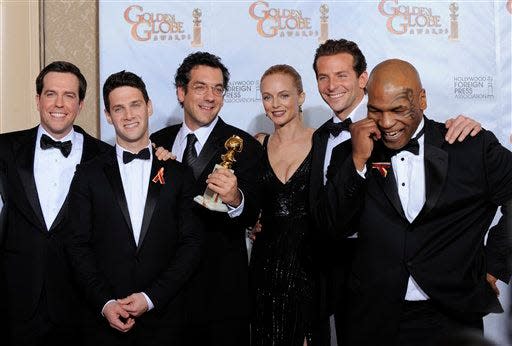 Mike Tyson, right, was part of the Hangover movie trilogy. He is seen posing with his costars at the 2010 Golden Globes where the original won the award for best motion picture, comedy or musical.