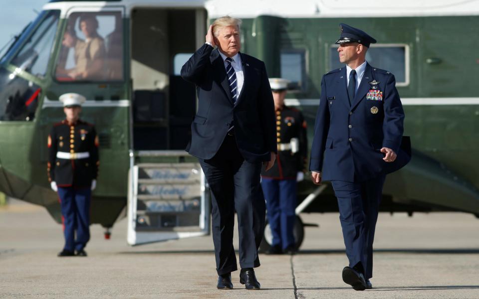 U.S. President Donald Trump walks to Air Force One as he departs for Greenville, South Carolina, from Joint Base Andrews, Maryland, U.S., October 16, 2017 - REUTERS