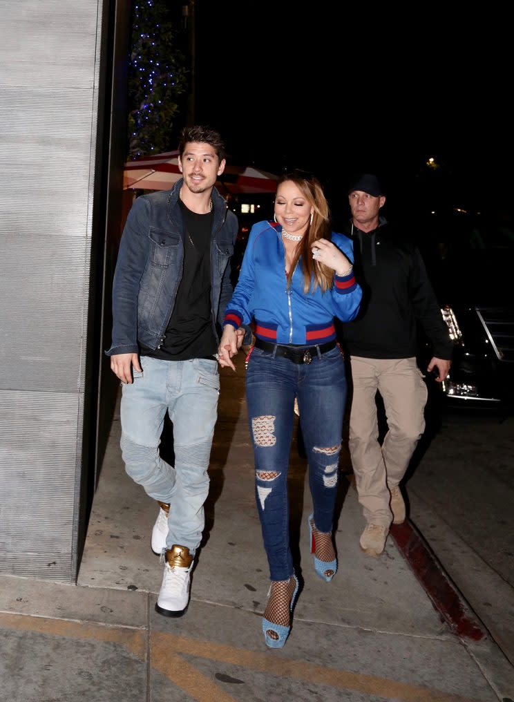 Mariah Carey out to dinner wearing a track jacket. (Photo: Splash)