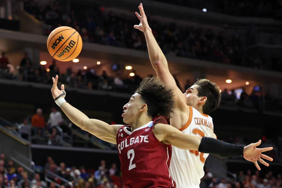Colgate guard Braeden Smith tries to get off a shot against Texas forward Brock Cunningham during the second half of the Longhorns' 81-61 win at Wells Fargo Arena. Texas will meet Penn State in the second round Saturday.