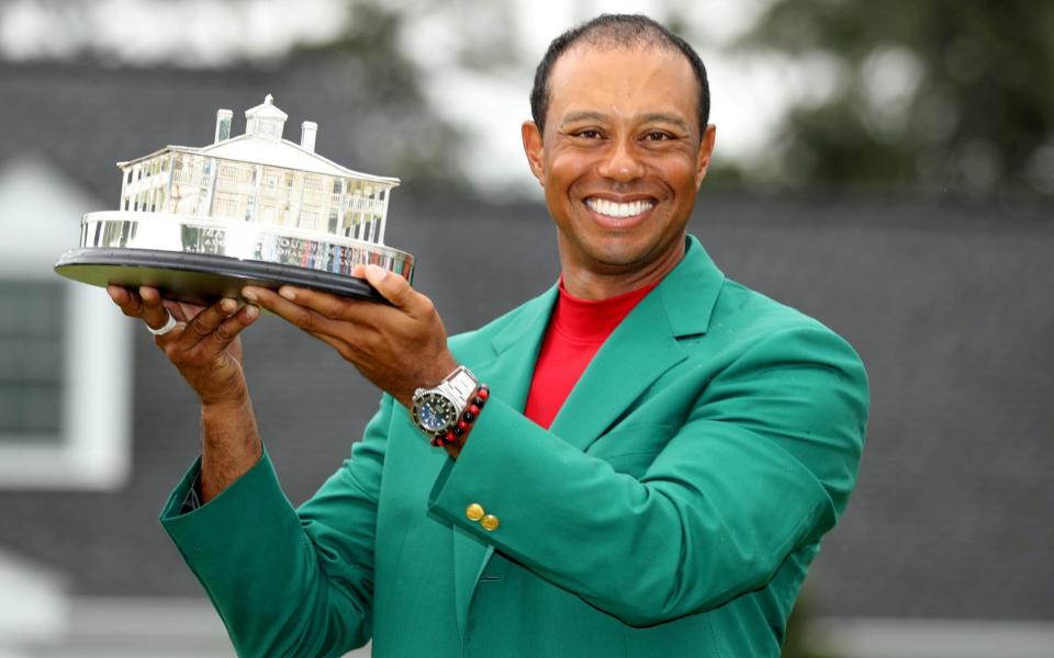 Tiger Woods of the U.S. celebrates with with his green jacket and trophy after winning the 2019 Masters - Sport calendar 2020: Latest news on events yet to fall due to coronavirus - REUTERS