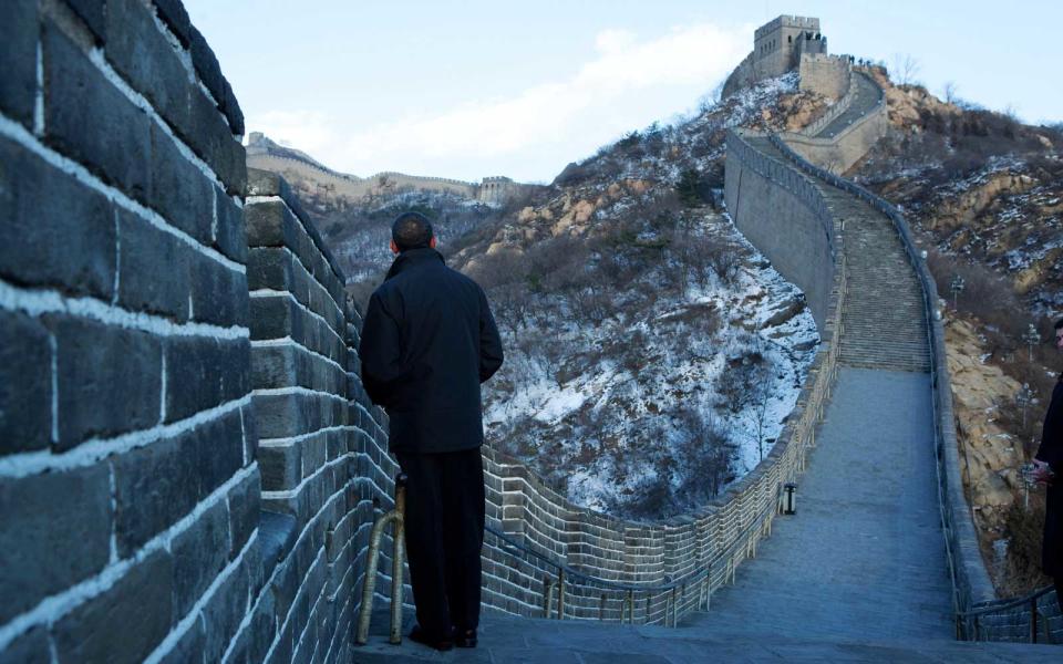 <p>Obama takes in the Chinese countryside in a rare quiet moment on The Great Wall of China.</p>