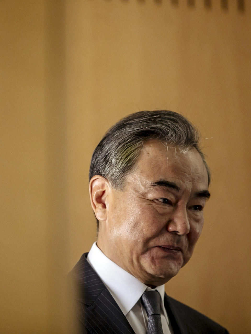 Chinese Foreign Minister Wang Yi delivers a speech during a press conference at the Institute for International Relations in Paris, Sunday, Aug. 30, 2020. Chinese Foreign Minister Wang Yi is in France as part of a five-country trip to Europe, his first since the coronavirus pandemic. (AP Photo/Kamil Zihnioglu)