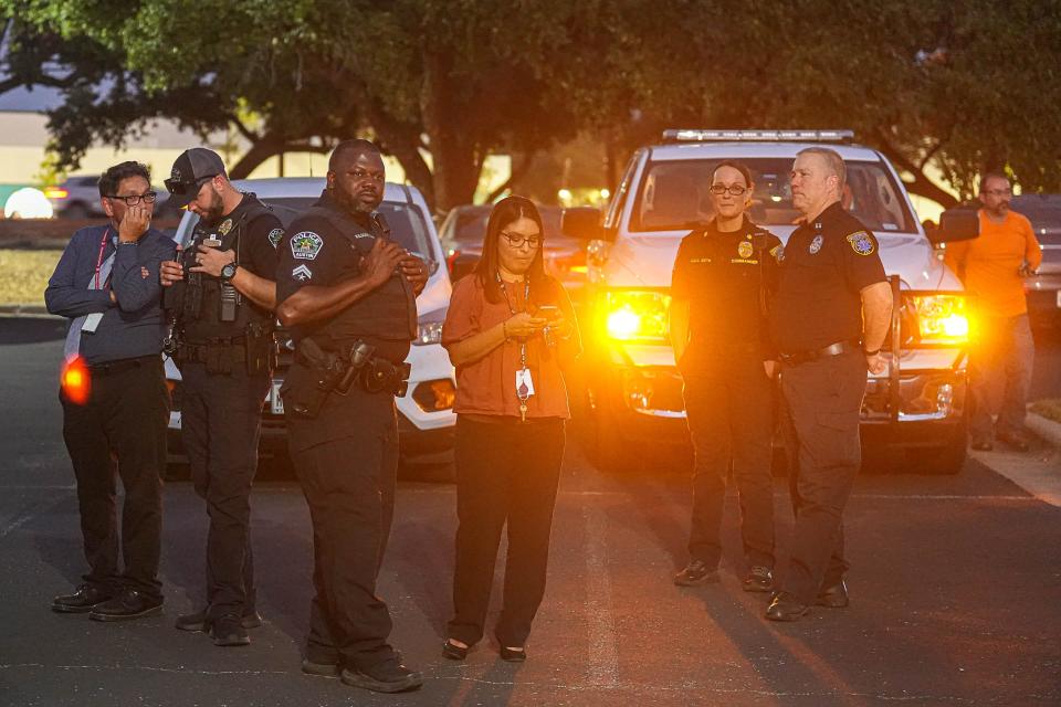 Austin police and Austin-Travis County EMS officials meet at the Great Hills Baptist Church for a media briefing Thursday evening about the shooting at the Arboretum shopping center.