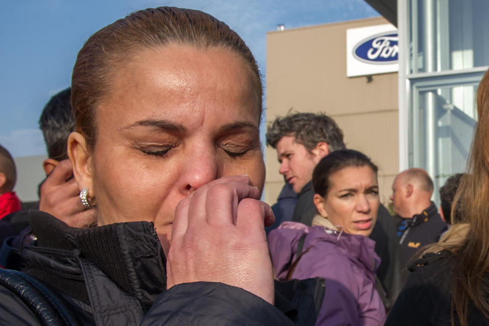 A Ford worker reacts after the European Ford management announced it would close the Ford plant in Genk, Belgium on Wednesday Oct. 24, 2012. A union leader says Ford has decided to close its factory in Genk, Belgium, at the end of 2014 in a move that will result in 4,500 direct job losses and 5,000 more among subcontractors. (AP Photo/Geert Vanden Wijngaert)