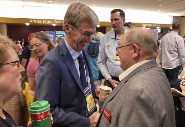 Republican gubernatorial candidate Dr. Scott Jensen works the delegates to the Minnesota GOP State Convention on Saturday, May 14, 2022, at the Mayo Civic Center in Rochester, Minn.. (AP Photo/Steve Karnowski)