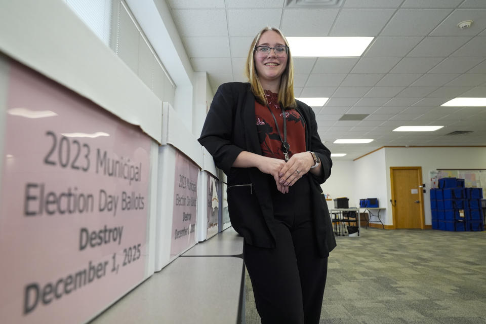 Kylie Moreland, the Monroe County Elections Supervisor poses in her office in Bloomington, Ind., Tuesday, Feb. 13, 2024. Moreland, 24, worked on the municipal election in November as assistant to the election supervisor and was promoted to the supervisor role Feb. 12. (AP Photo/Michael Conroy)