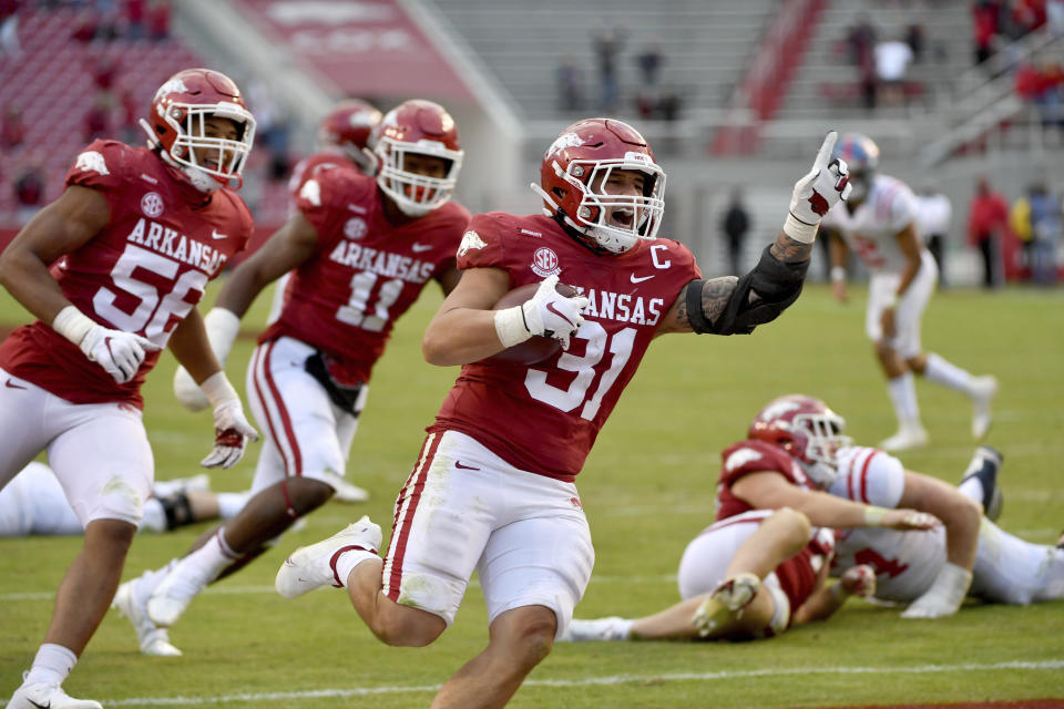 Arkansas defensive back Grant Morgan (31) celebrates as he returns an interception for a touchdown against Mississippi during the second half of an NCAA college football game Saturday, Oct. 17, 2020, in Fayetteville, Ark. (AP Photo/Michael Woods)