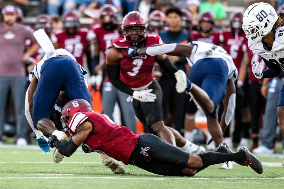 NMSU defensive back Syrus Dumas tackles an offensive FIU player during a NMSU football game on Saturday, Oct. 1, 2022, at the Aggie Memorial Stadium. 