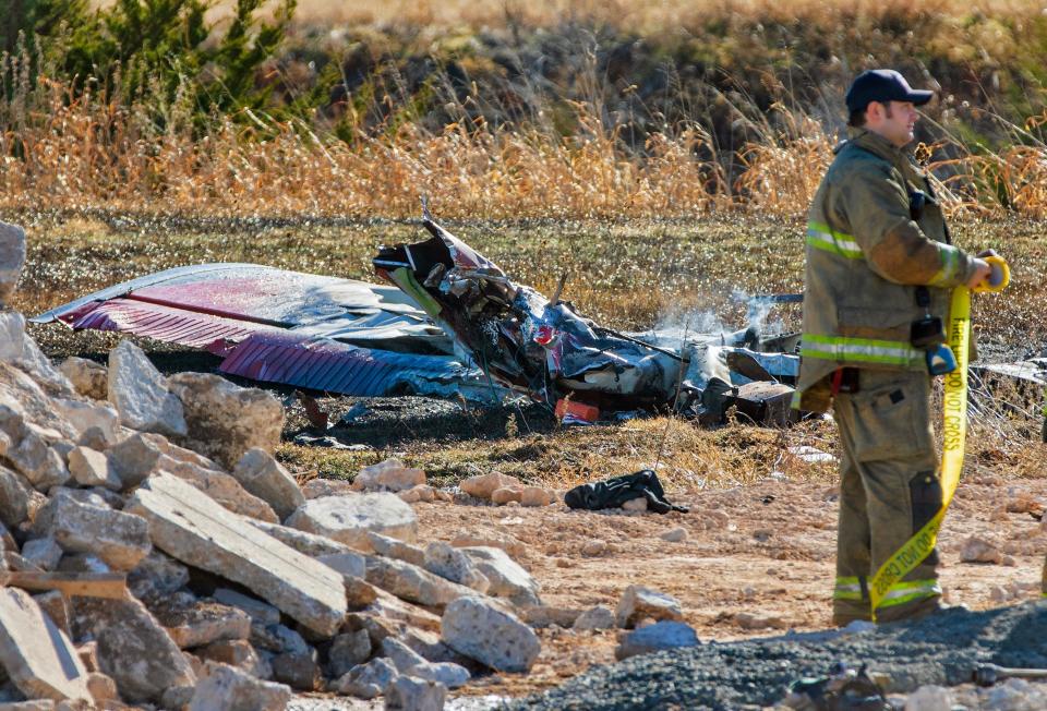 The Oklahoma City Fire Department is seen at the site of a plane crash on Dec. 10, 2023, near Wiley Post Airport in Bethany.