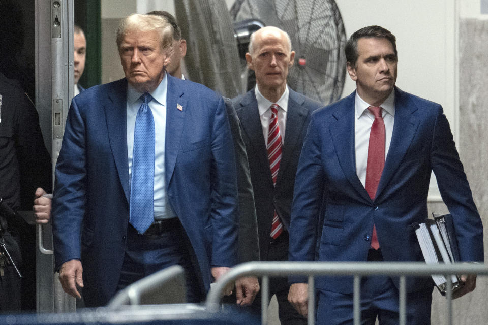 Former President Donald Trump, his attorney Todd Blanche, right, and U.S. Sen Rick Scott, R-Fla., rear center, arrive for Trump's trial at Manhattan Criminal Court, Thursday, May 9, 2024, in New York. (Jeenah Moon/Pool Photo via AP)
