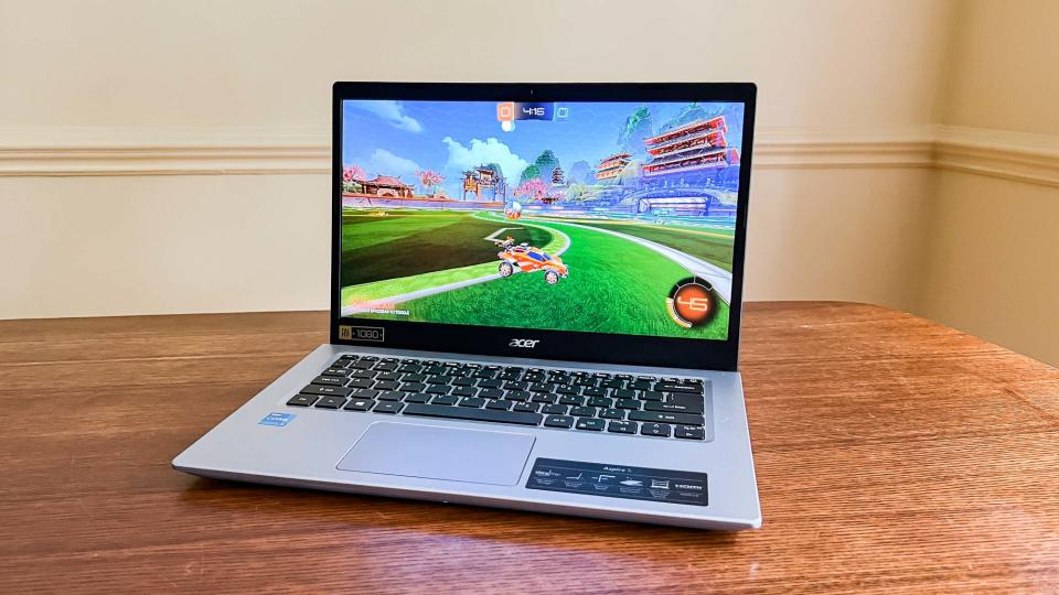 Acer Aspire 5 (2022) open on desk with rocket league playing onscreen