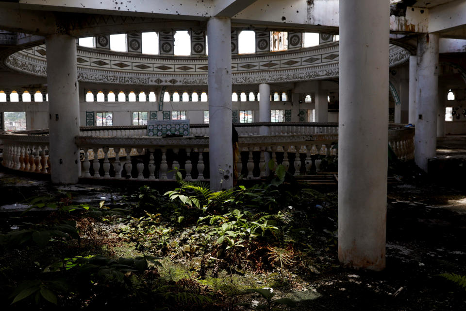 Weeds have grown at the bullet-riddled Grand Mosque in Marawi City, Lanao del Sur province, Philippines. Nature has taken over many structures in the city as it remains abandoned two years after pro-Islamic State militants began their attack on May 23, 2017. (Photo: Eloisa Lopez/Reuters)