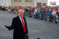 U.S. President Donald Trump talks to the media as Trump supporters gather in Rochester