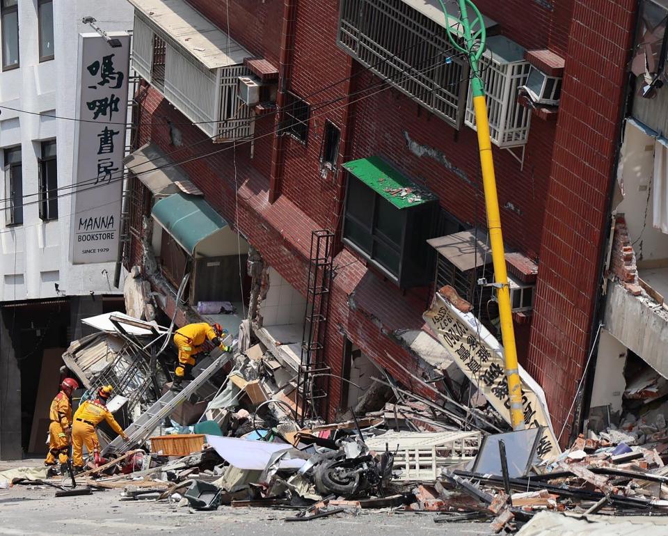 This handout from Taiwan's Military News Agency taken and released on April 3, 2024 shows military personnel aiding in rescue and relief efforts by searching for survivors in a damaged building in Hualien, after a major earthquake hit Taiwan's east. At least four people were killed and nearly 60 injured on April 3 by a powerful earthquake in Taiwan that damaged dozens of buildings and prompted tsunami warnings that extended to Japan and the Philippines before being lifted.