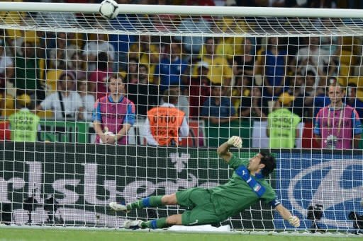 Italian goalkeeper Gianluigi Buffon watches as Ashley Young's penalty kick hirs the crossbar during Sunday night's penalty shootout in England's Euro 2012 quarter final against England