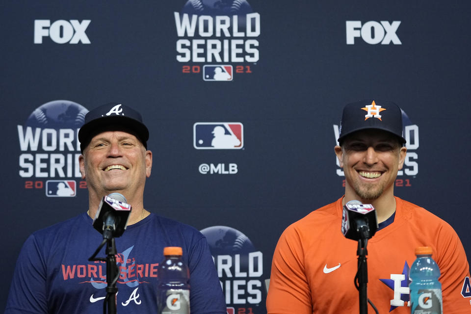 Atlanta Braves manager Brian Snitker and Houston Astros hitting coach Troy Snitker speaks during a news conference before Game 1 of baseball's World Series Tuesday, Oct. 26, 2021, in Houston. (AP Photo/Ashley Landis)