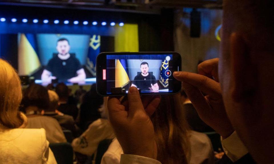 Ukraine’s president, Volodymyr Zelenskiy, delivers a video address to the participants of the Ukraine recovery conference.