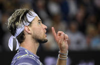 Austria's Dominic Thiem gestures to the chair umpire during his men's singles final against Serbia's Novak Djokovic at the Australian Open tennis championship in Melbourne, Australia, Sunday, Feb. 2, 2020. (AP Photo/Andy Brownbill)