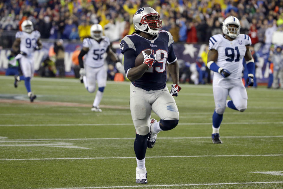 New England Patriots running back LeGarrette Blount (29) heads down field for a 75 yard touchdown run during the second half of an AFC divisional NFL playoff football game against the Indianapolis Colts in Foxborough, Mass., Saturday, Jan. 11, 2014. (AP Photo/Matt Slocum)