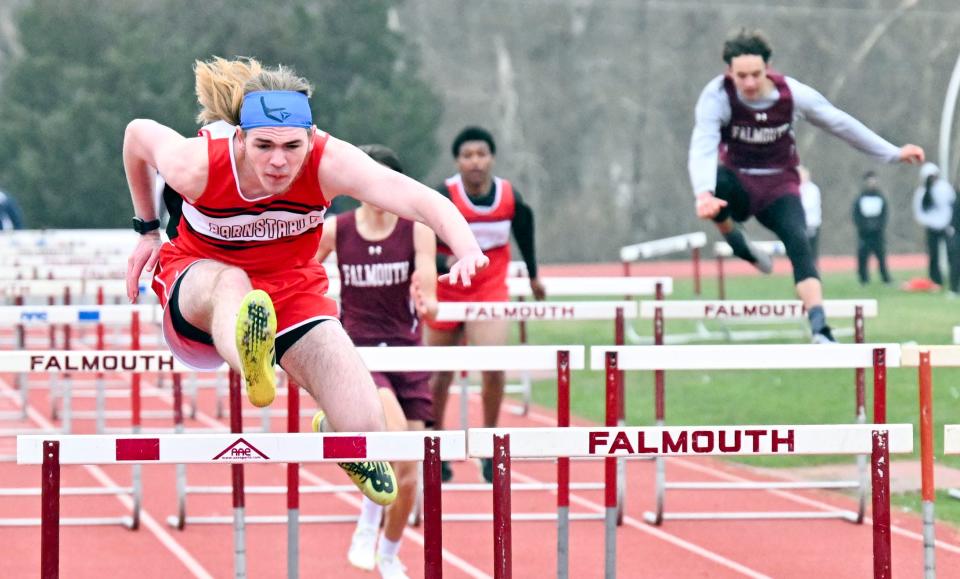 FALMOUTH   04/05/23 Casey Holland of Barnstable leads the field against Falmouth in the 110 high hurdles.