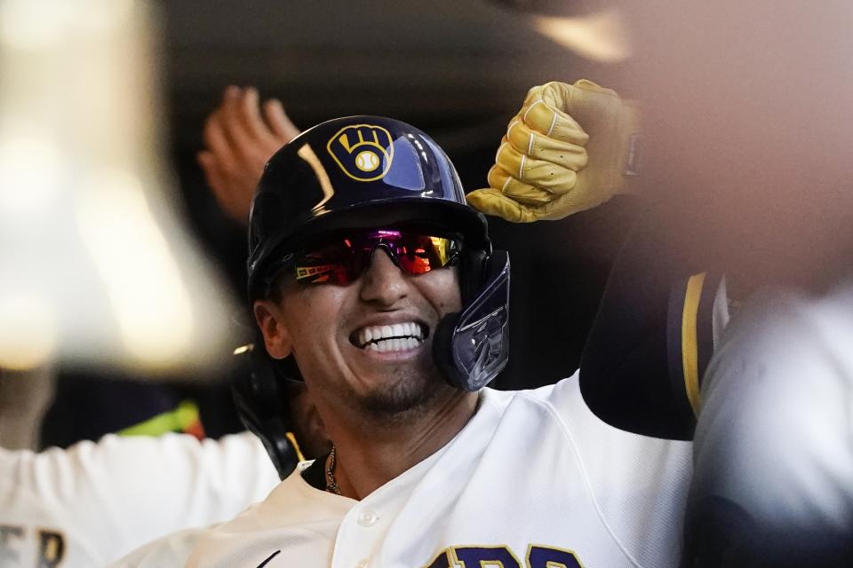 Milwaukee Brewers' Tyrone Taylor is congratulated after hitting a three-run home run during the fourth inning of a baseball game against the St. Louis Cardinals Thursday, June 23, 2022, in Milwaukee. (AP Photo/Morry Gash)